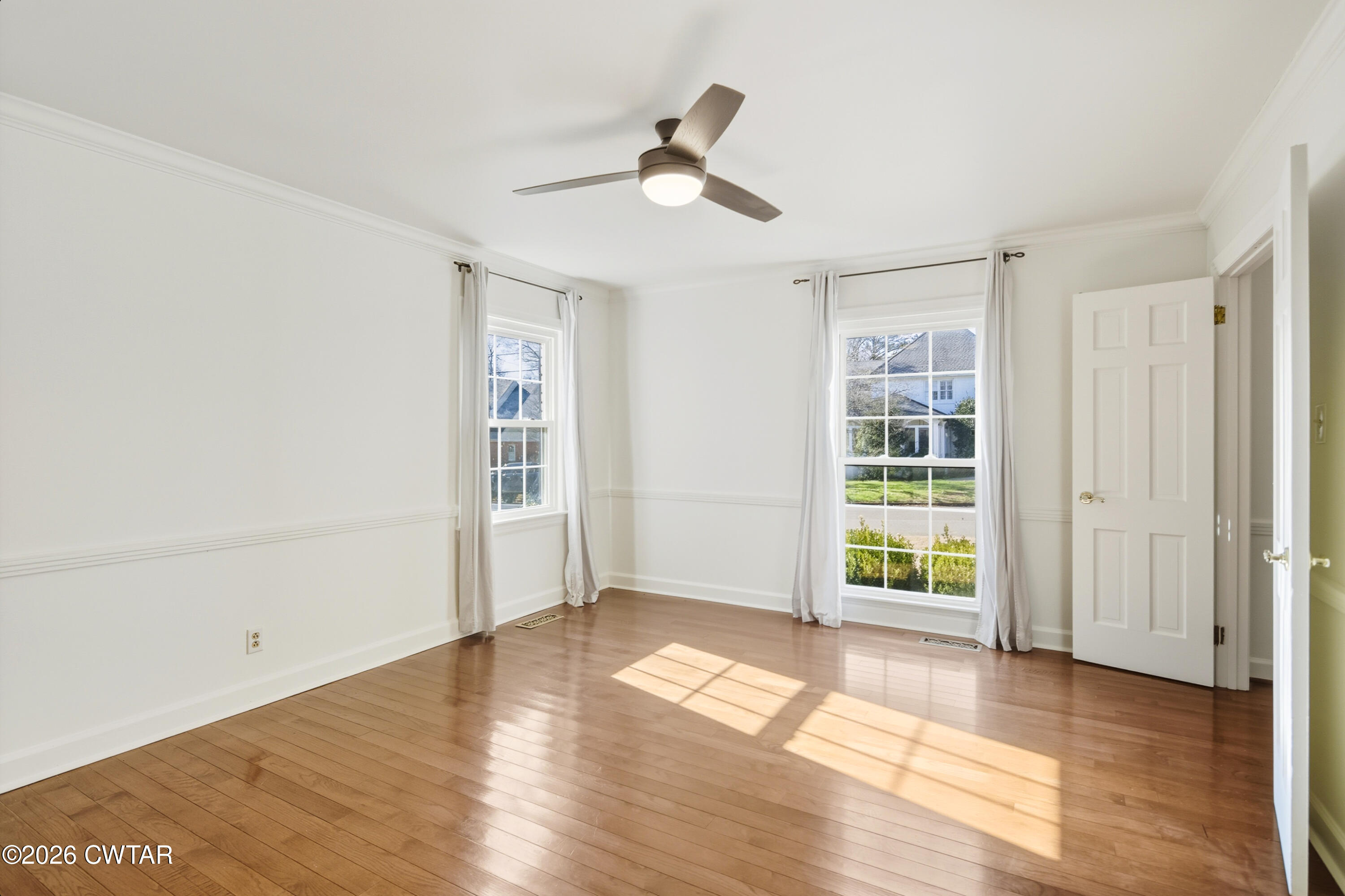 126 Rooks Drive Brownsville, TN 38012 - Photo 14 of 52 wooden floor in an empty room with a window