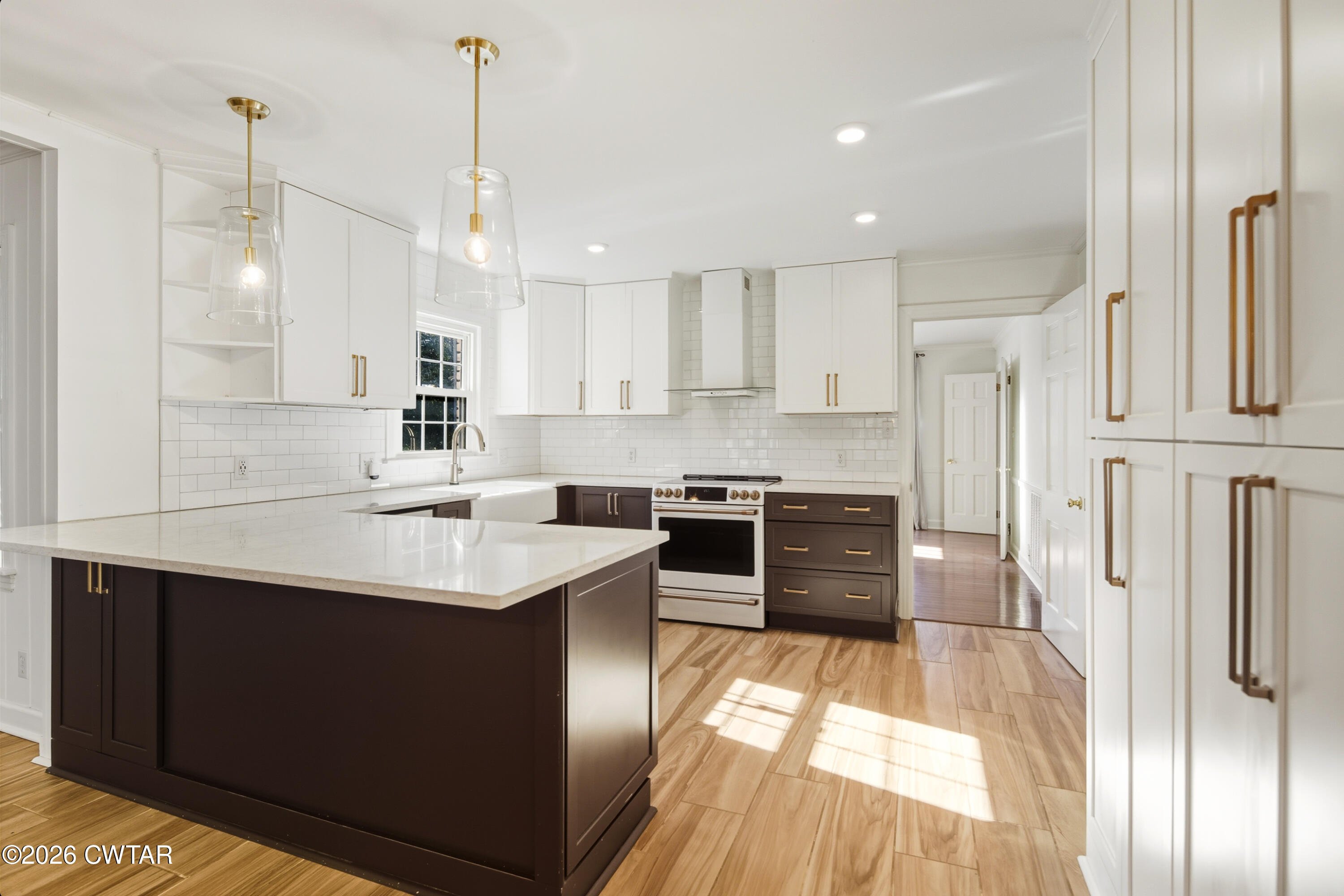 126 Rooks Drive Brownsville, TN 38012 - Photo 18 of 52 a kitchen with stainless steel appliances kitchen island granite countertop a sink stove and refrigerator
