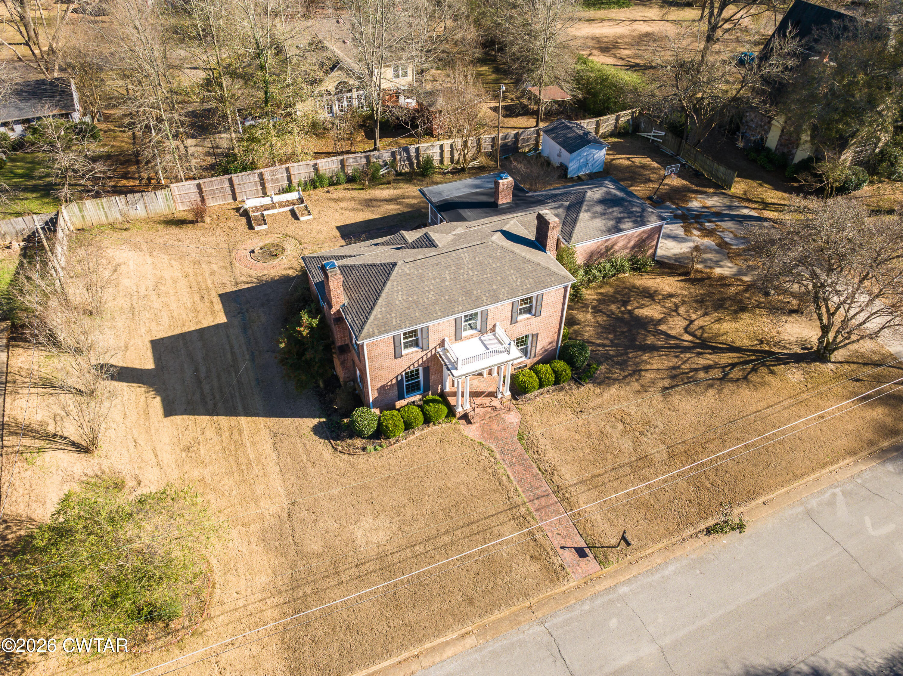 126 Rooks Drive Brownsville, TN 38012 - Photo 3 of 52 a picture of houses with yard and mountain view in back