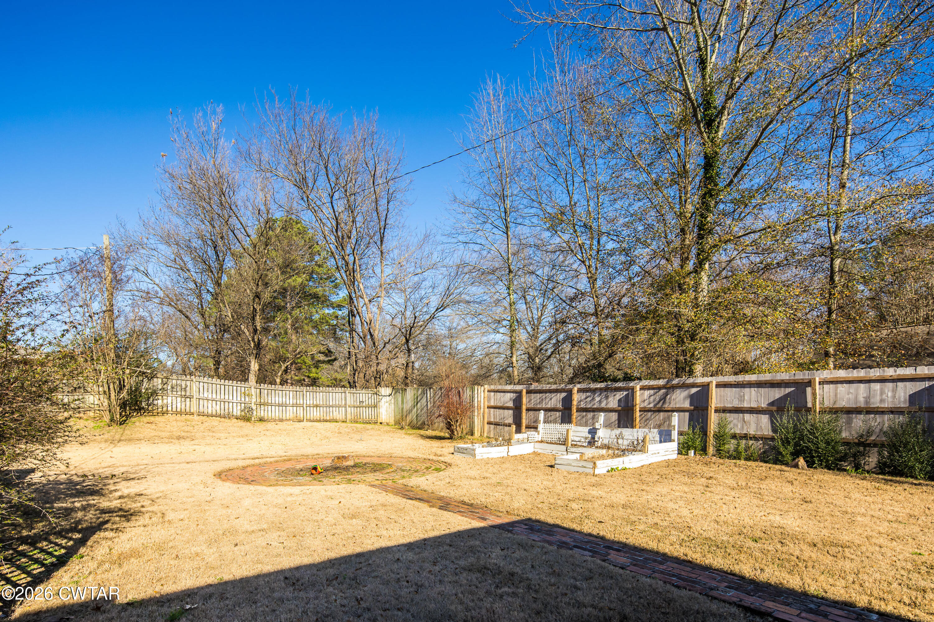126 Rooks Drive Brownsville, TN 38012 - Photo 43 of 52 a view of yard with swimming pool and trees