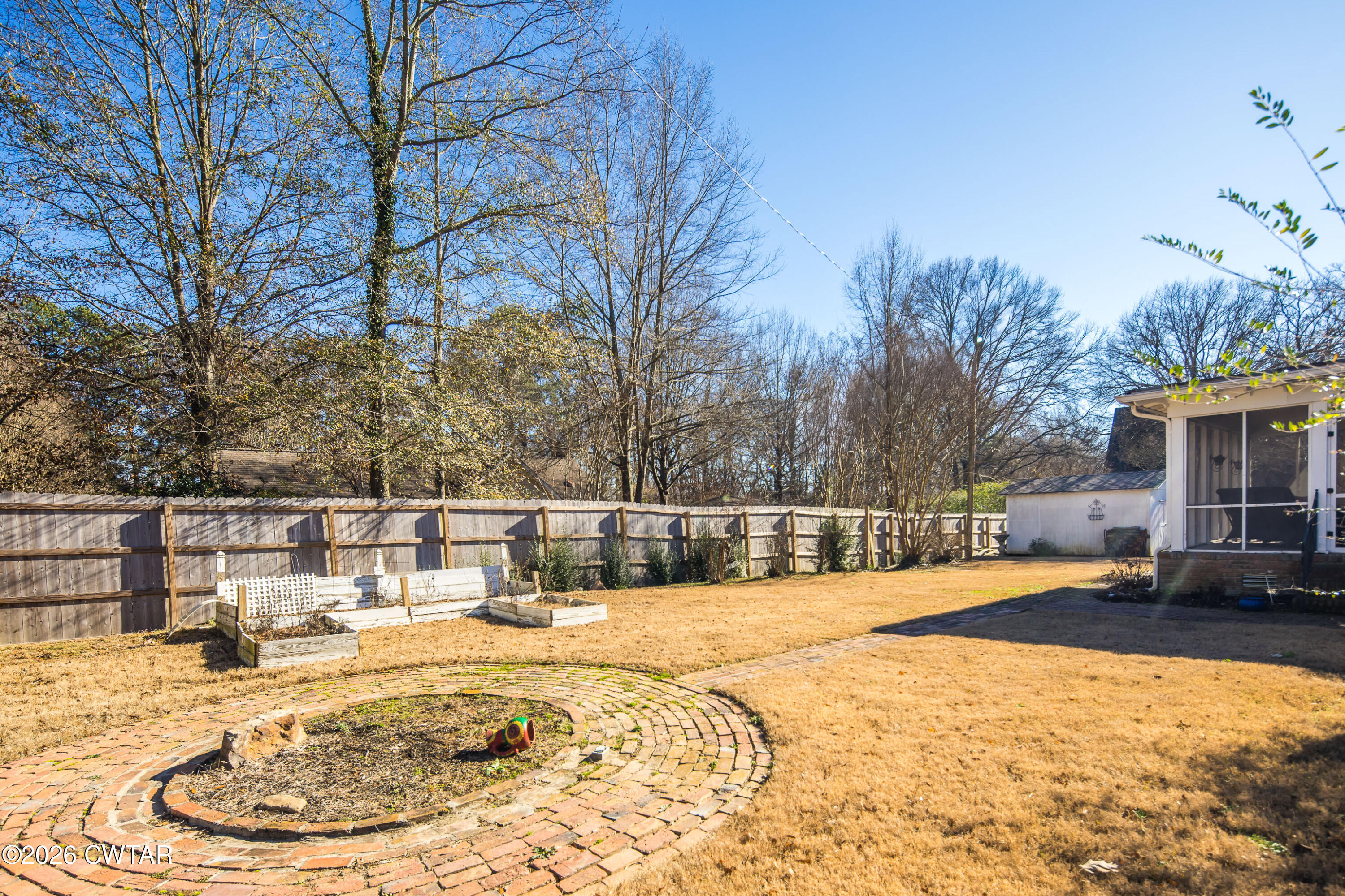 126 Rooks Drive Brownsville, TN 38012 - Photo 50 of 52 a swimming pool with outdoor seating and yard