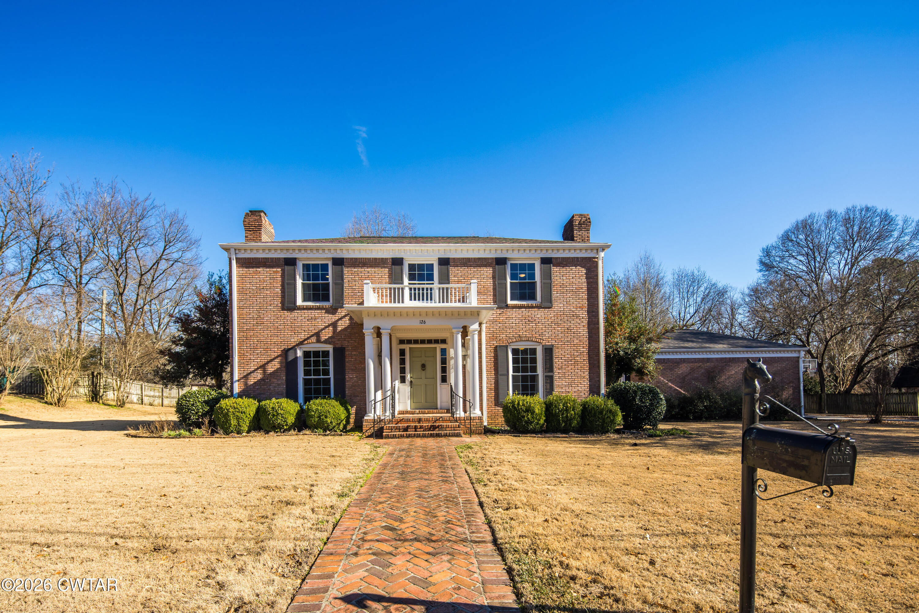 126 Rooks Drive Brownsville, TN 38012 - Photo 6 of 52 a front view of a house with a yard