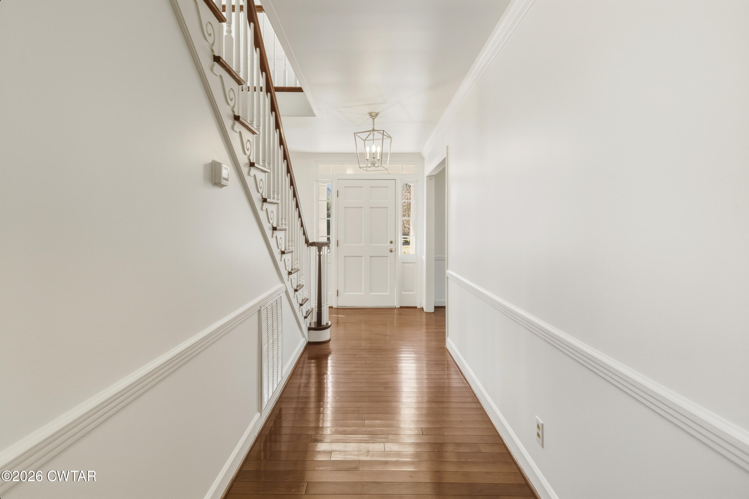 126 Rooks Drive Brownsville, TN 38012 - Photo 8 of 52 a view of a hallway with wooden floor and staircase