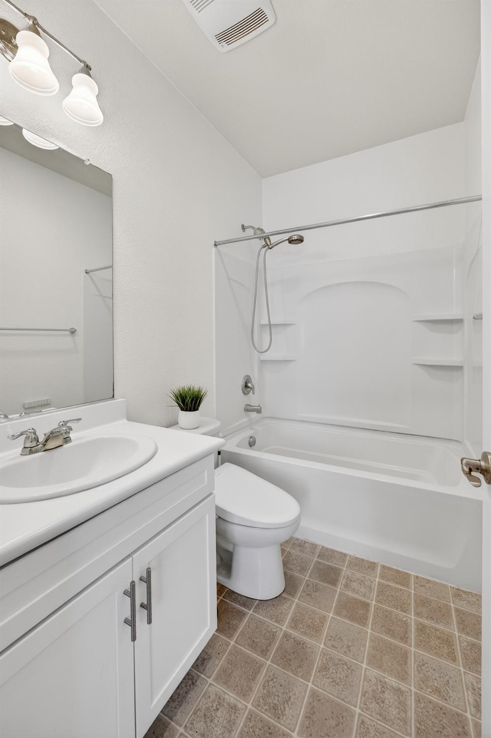 7620 Ferrell Way Elk Grove, CA 95757 - Photo 12 of 75 a bathroom with a sink a toilet and shower