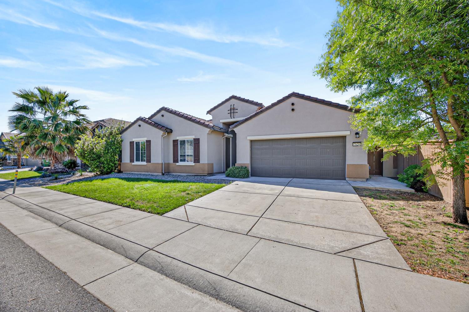 7620 Ferrell Way Elk Grove, CA 95757 - Photo 15 of 75 a front view of a house with yard and garage