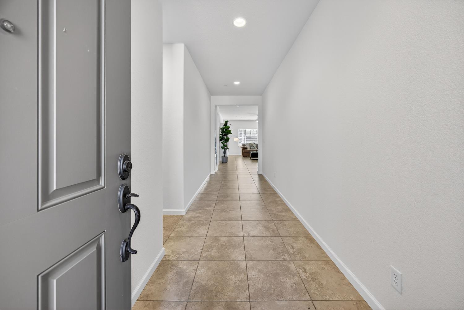 7620 Ferrell Way Elk Grove, CA 95757 - Photo 18 of 75 a view of a hallway with wooden floor and staircase