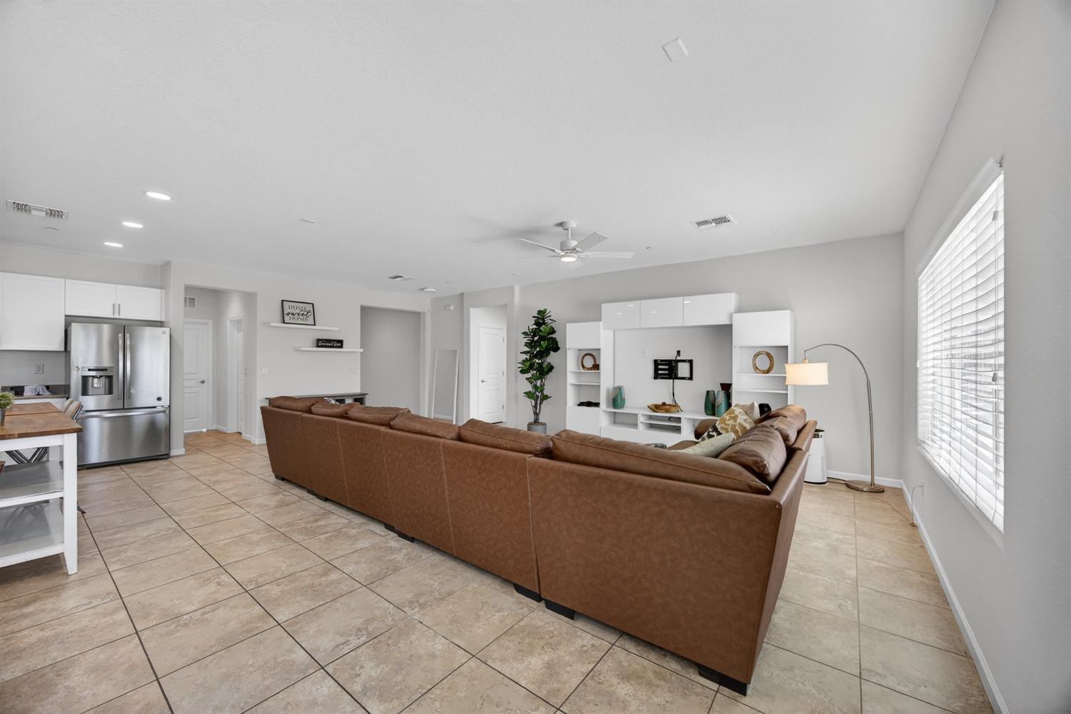 7620 Ferrell Way Elk Grove, CA 95757 - Photo 21 of 75 a living room with furniture and a large window