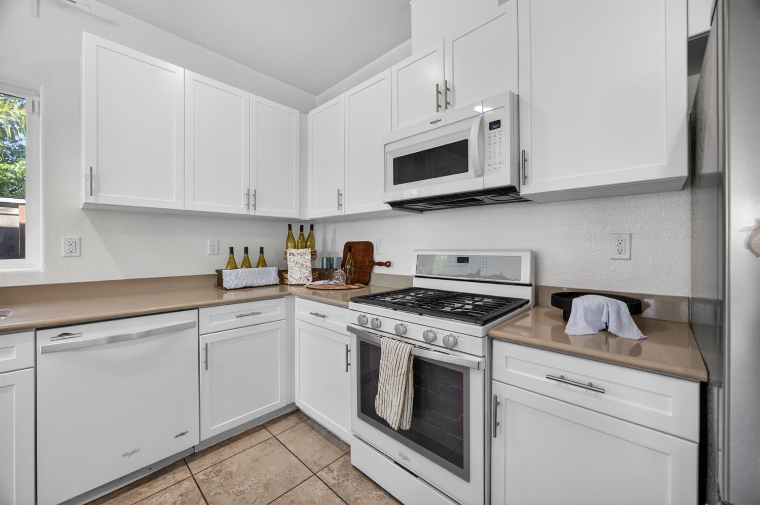 7620 Ferrell Way Elk Grove, CA 95757 - Photo 25 of 75 a kitchen with white cabinets stainless steel appliances and sink