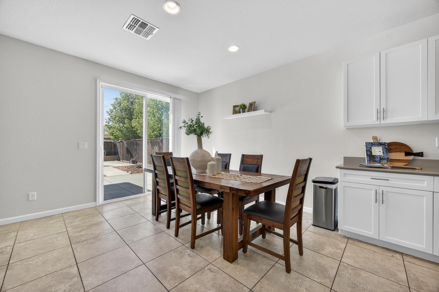 7620 Ferrell Way Elk Grove, CA 95757 - Photo 31 of 75 a view of a dining room with furniture and window