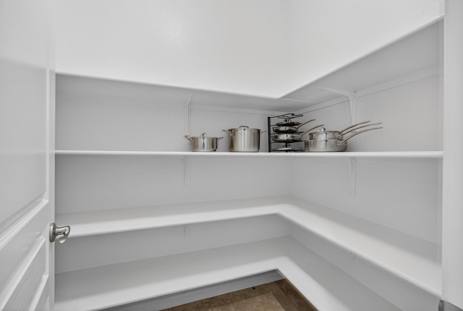 7620 Ferrell Way Elk Grove, CA 95757 - Photo 32 of 75 a view of storage and utility room with empty racks