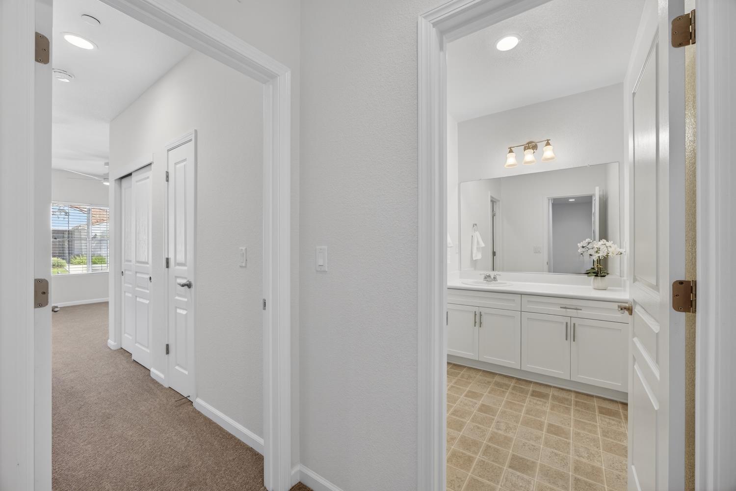 7620 Ferrell Way Elk Grove, CA 95757 - Photo 46 of 75 a bathroom with a sink and mirror with toilet