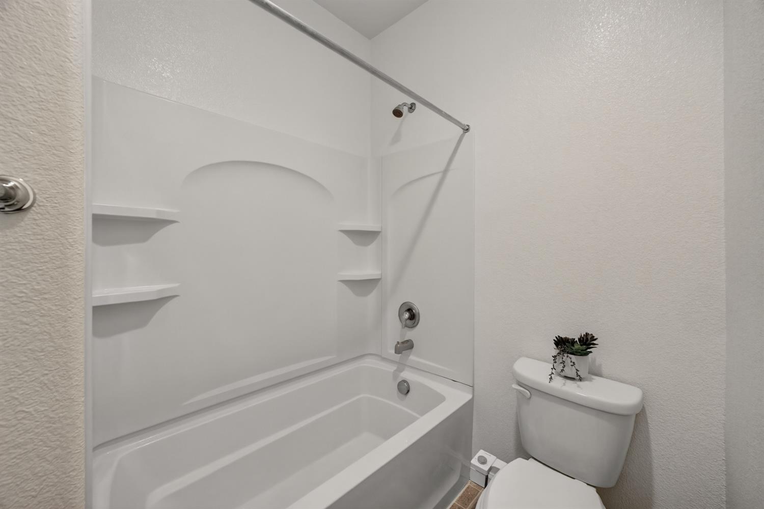 7620 Ferrell Way Elk Grove, CA 95757 - Photo 47 of 75 a bathroom with a sink a toilet and shower
