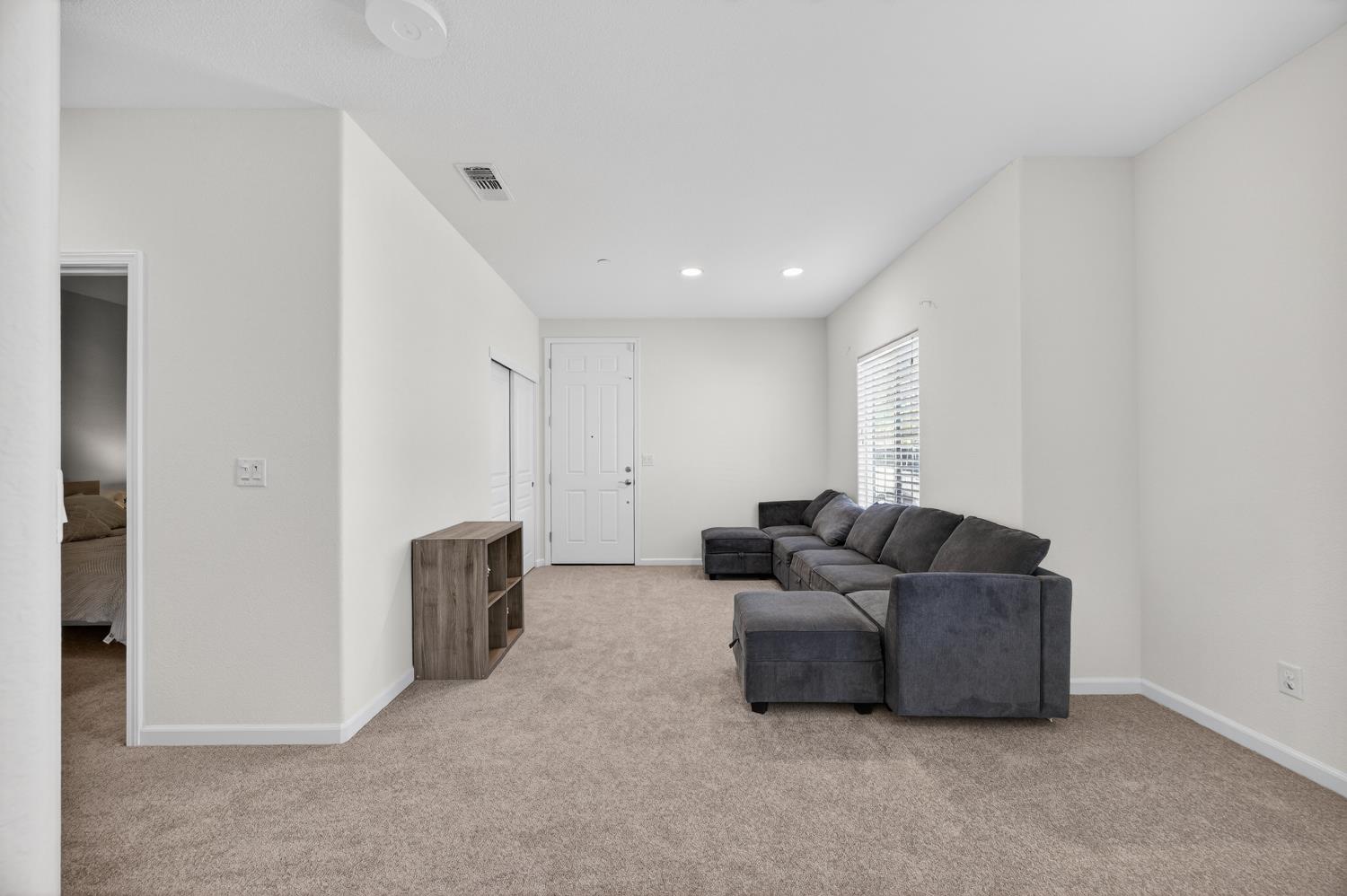 7620 Ferrell Way Elk Grove, CA 95757 - Photo 50 of 75 a living room with furniture and a refrigerator