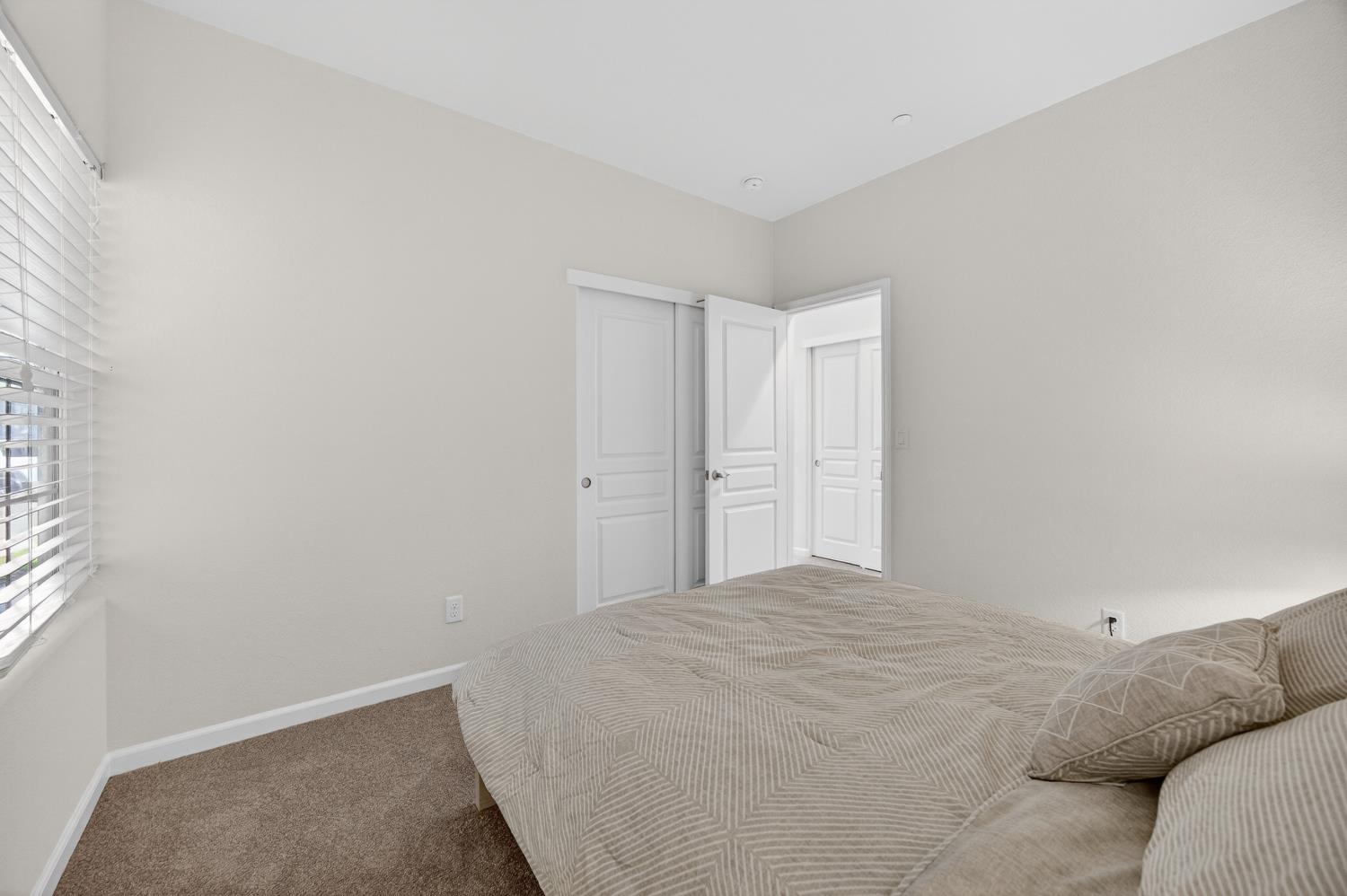 7620 Ferrell Way Elk Grove, CA 95757 - Photo 56 of 75 a bedroom with a bed and a window
