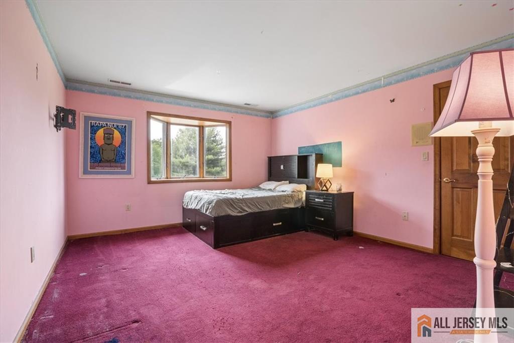 167 Federal Road Monroe Township, NJ 08831 - Photo 27 of 46 a bedroom with a bed dresser and a window