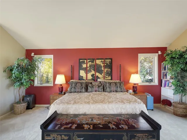 a bedroom with a bed and window