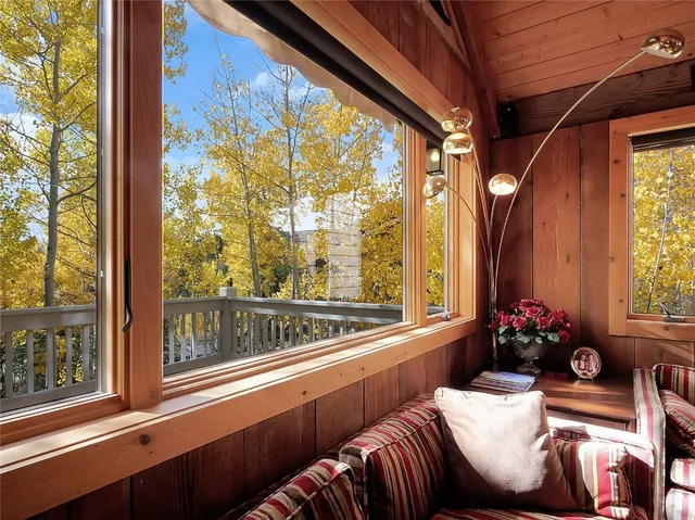 a living room filled with furniture and a large window