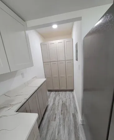 a view of hallway with wooden floor