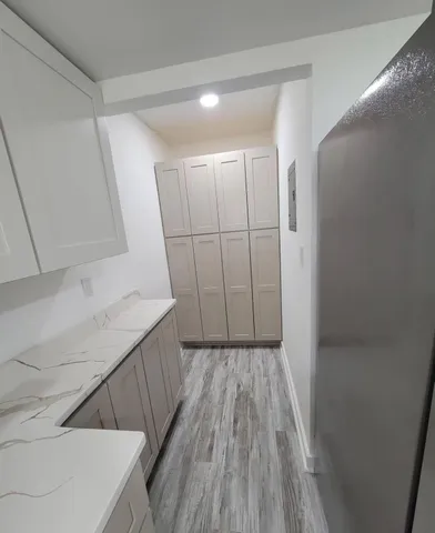 a view of hallway with wooden floor