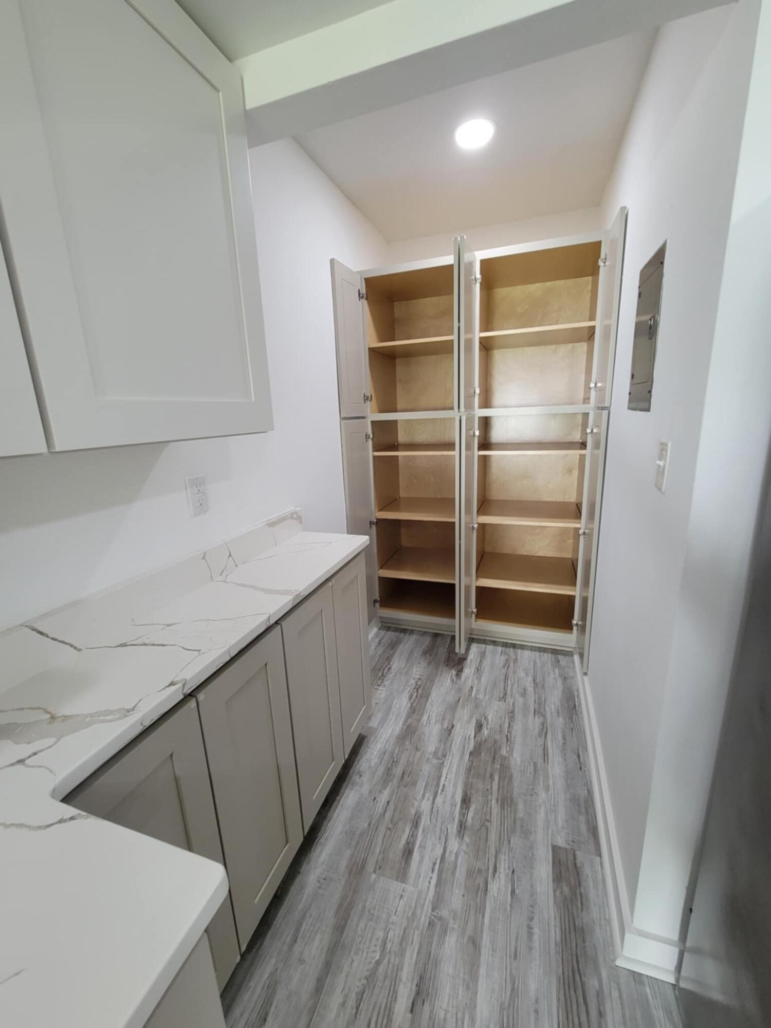 145 4th Avenue, Unit B3 Shalimar, FL 32579 - Photo 13 of 46 a room with wooden floor and electronic appliances