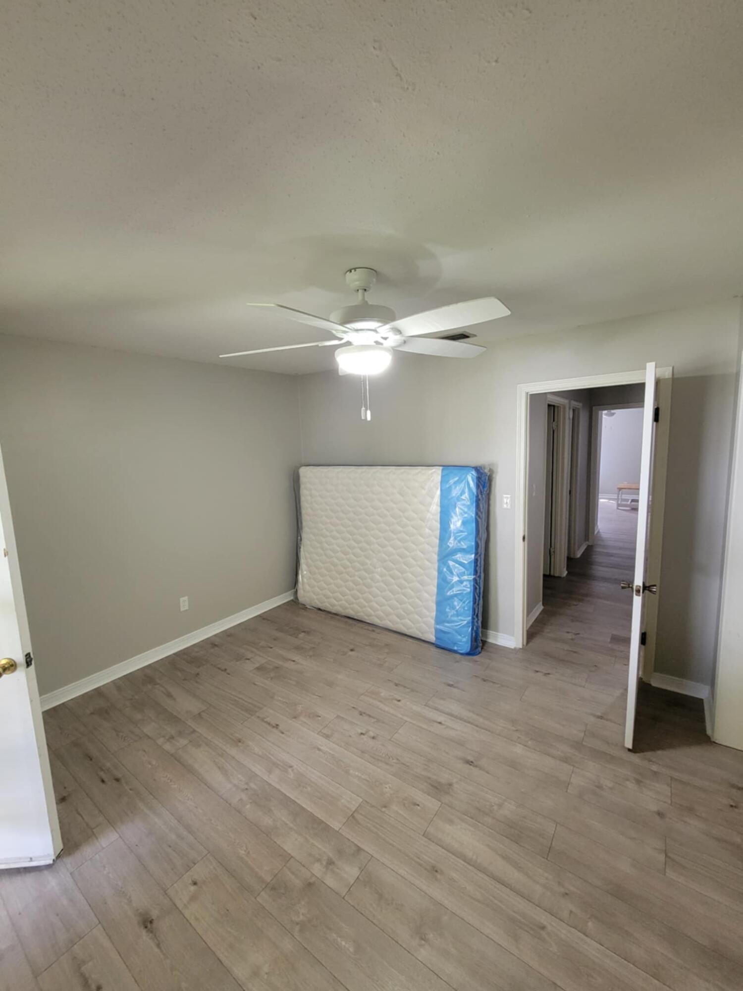145 4th Avenue, Unit B3 Shalimar, FL 32579 - Photo 26 of 46 a view of a livingroom with wooden floor and staircase