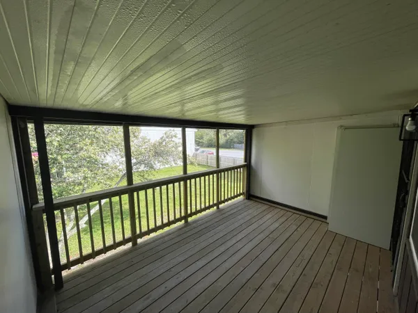 a bathroom with a glass door and shower