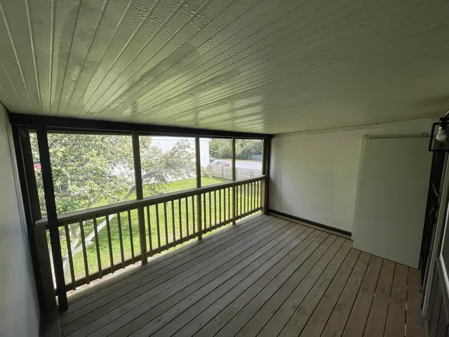 a bathroom with a glass door and shower