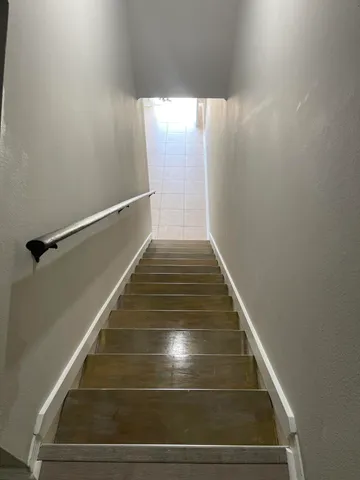 a view of a chair and table in the balcony