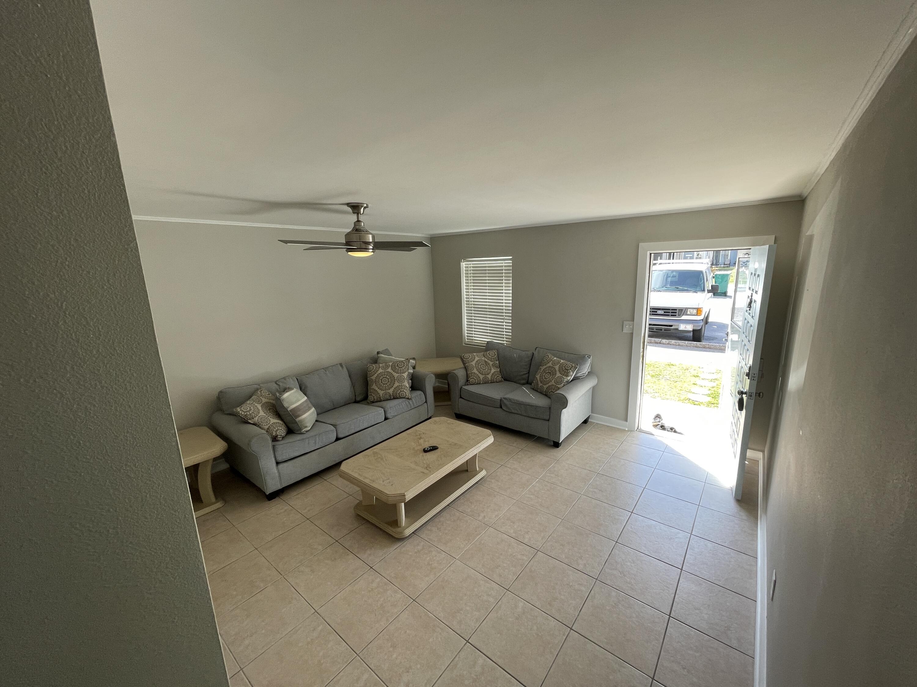 145 4th Avenue, Unit B3 Shalimar, FL 32579 - Photo 43 of 46 a living room with furniture and a window