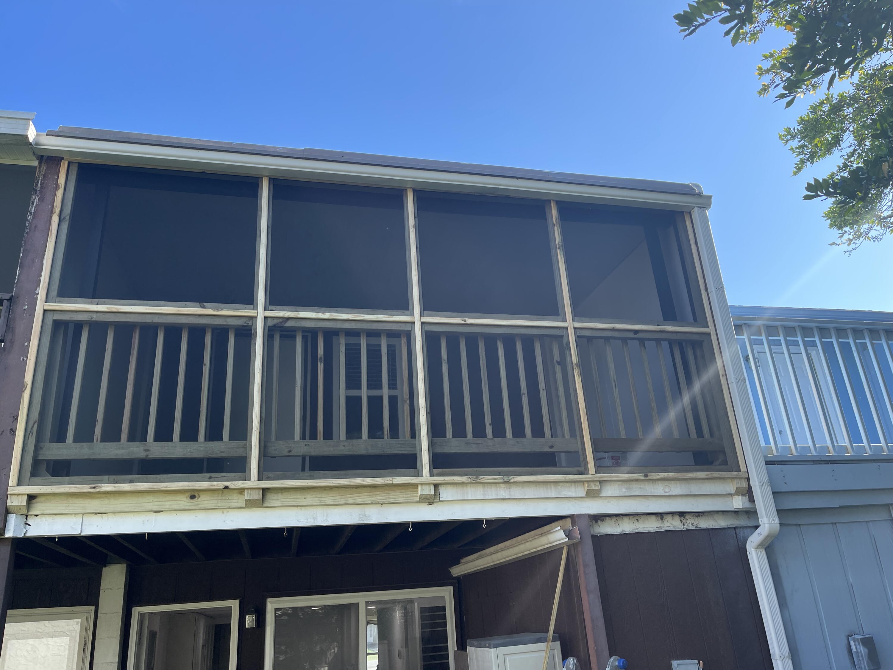 145 4th Avenue, Unit B3 Shalimar, FL 32579 - Photo 44 of 46 a view of a chair and table in the balcony