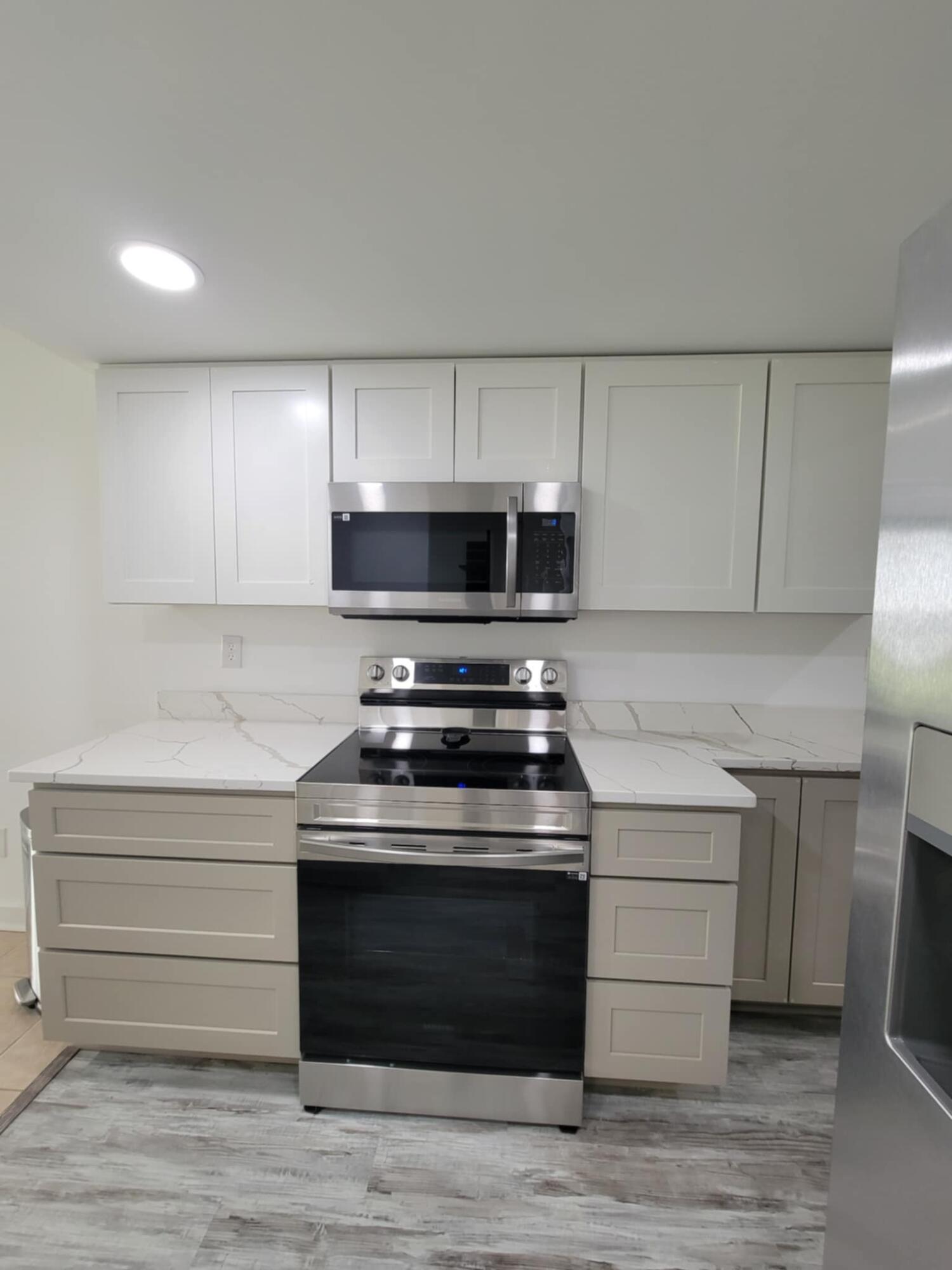 145 4th Avenue, Unit B3 Shalimar, FL 32579 - Photo 10 of 46 a stove top oven sitting inside of a kitchen