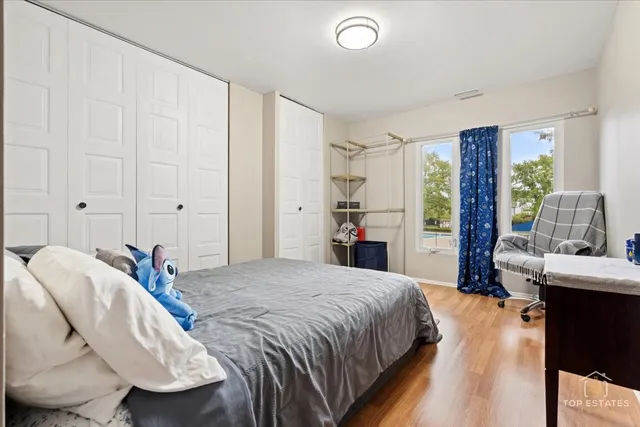 a bedroom with a bed and a table