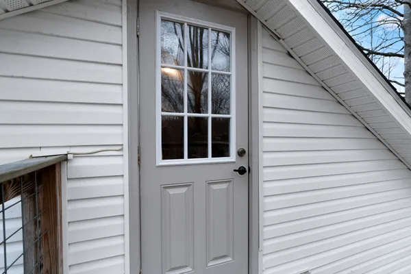 a view of house with a yard
