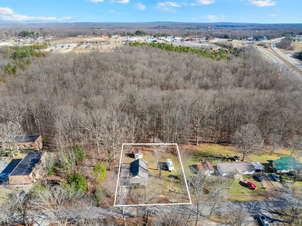a front view of a house with trees