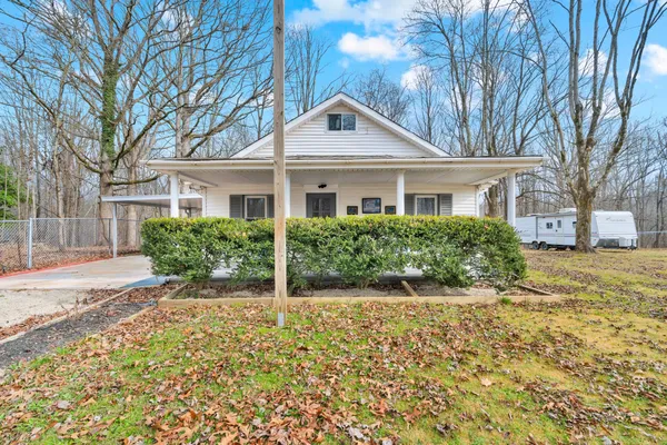 a view of a house with a yard