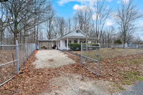 a view of a patio with a table and chairs