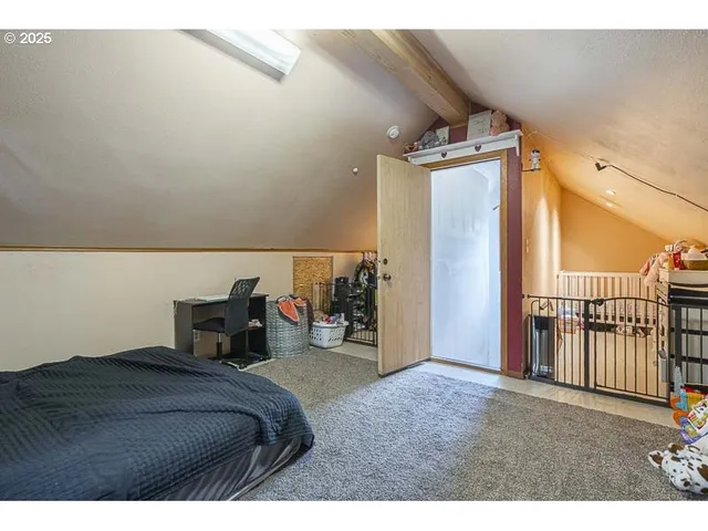 a bedroom with furniture and a window