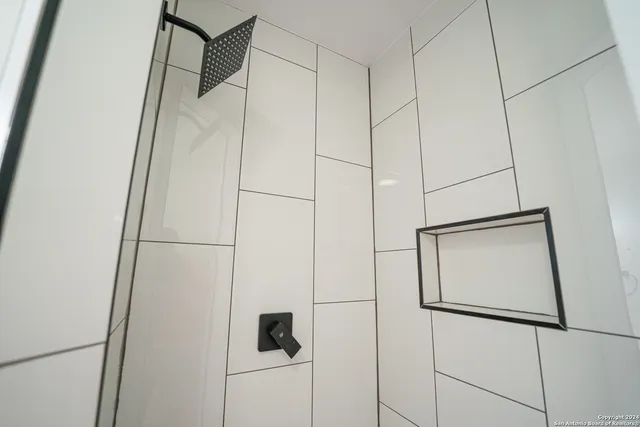 a bathroom with a sink a mirror and vanity