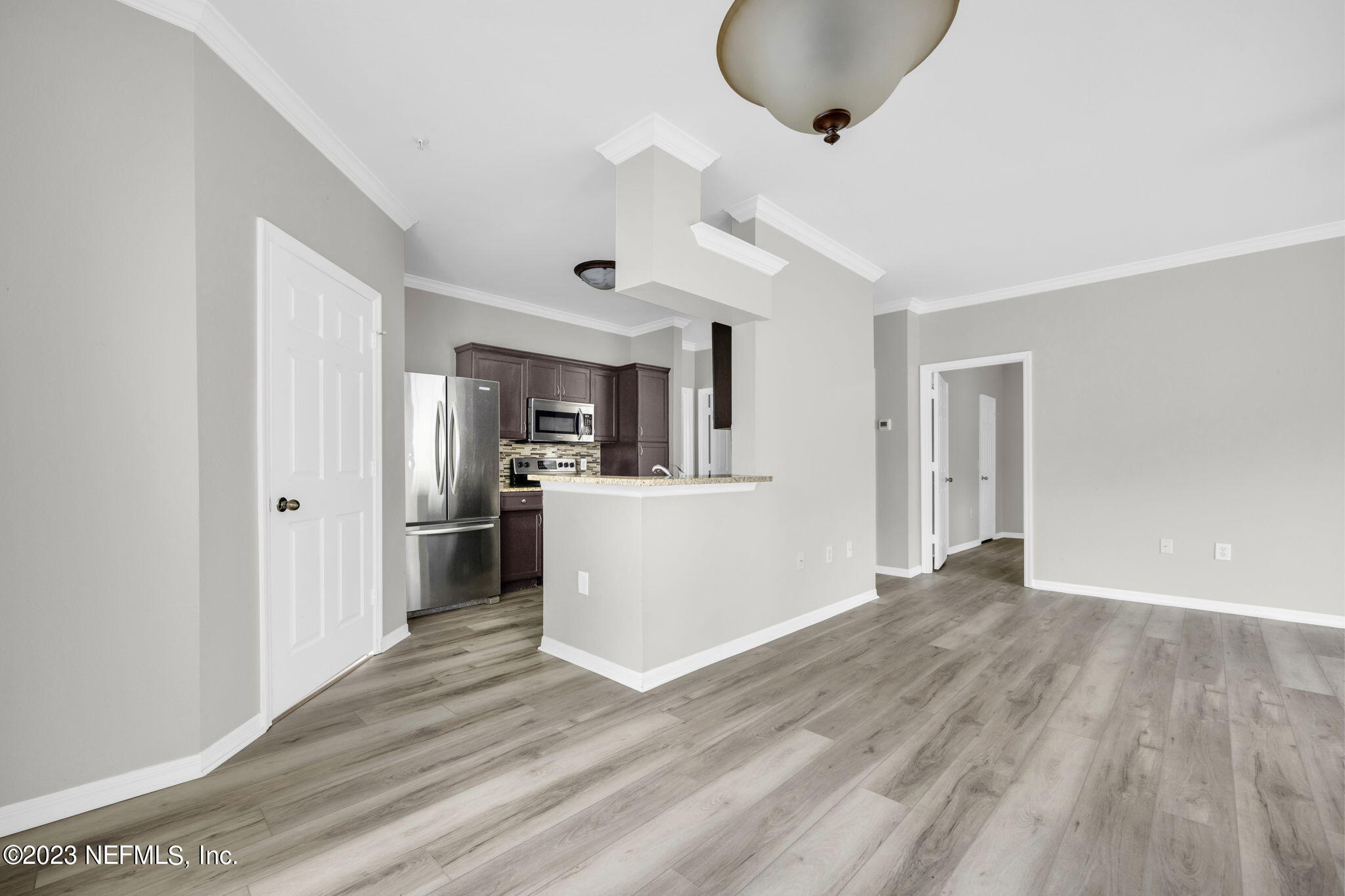 10961 Burnt Mill Road, Unit 427 Jacksonville, FL 32256 - Photo 11 of 50 a view of a kitchen from the hallway