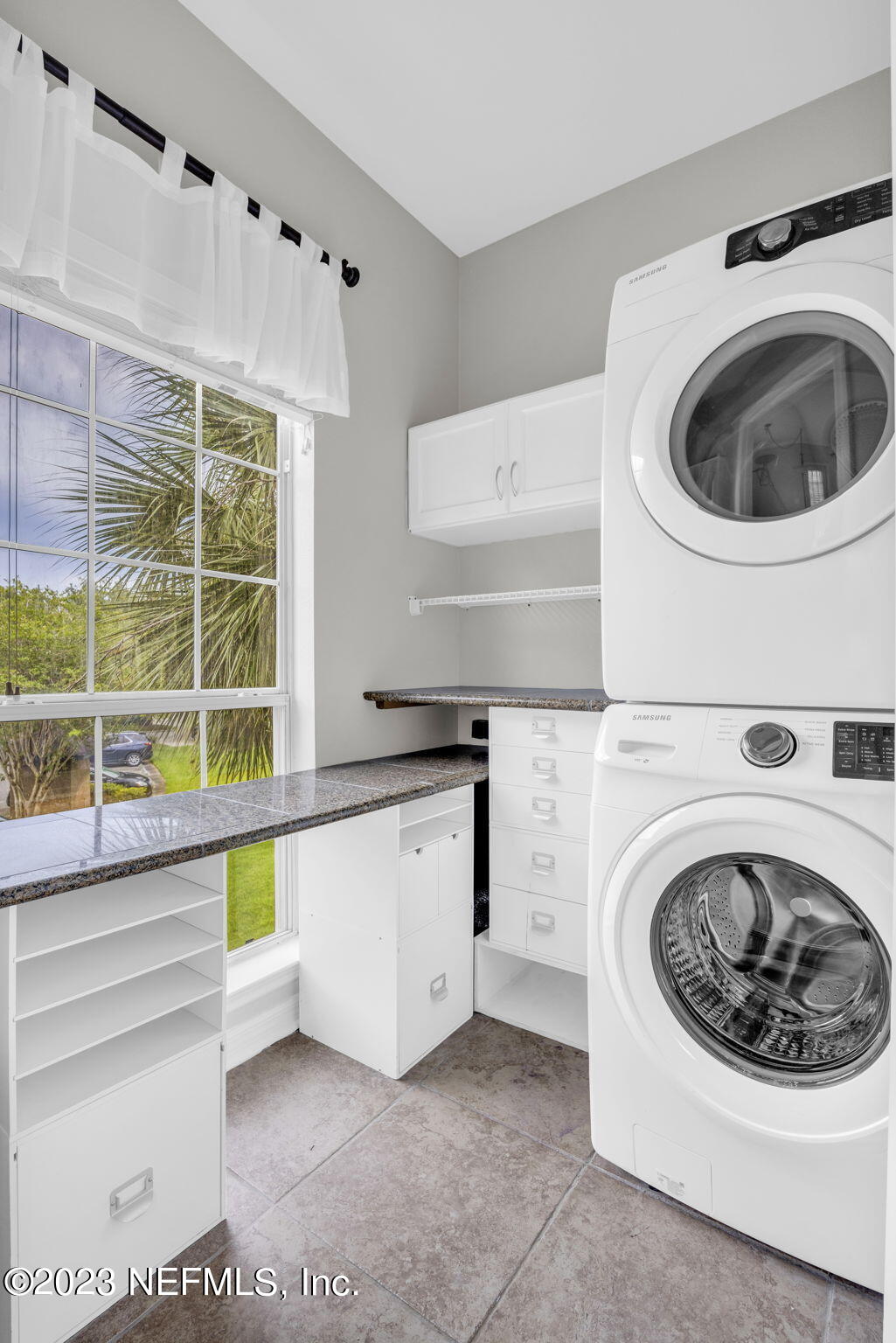 10961 Burnt Mill Road, Unit 427 Jacksonville, FL 32256 - Photo 16 of 50 a kitchen with a washer and dryer in it