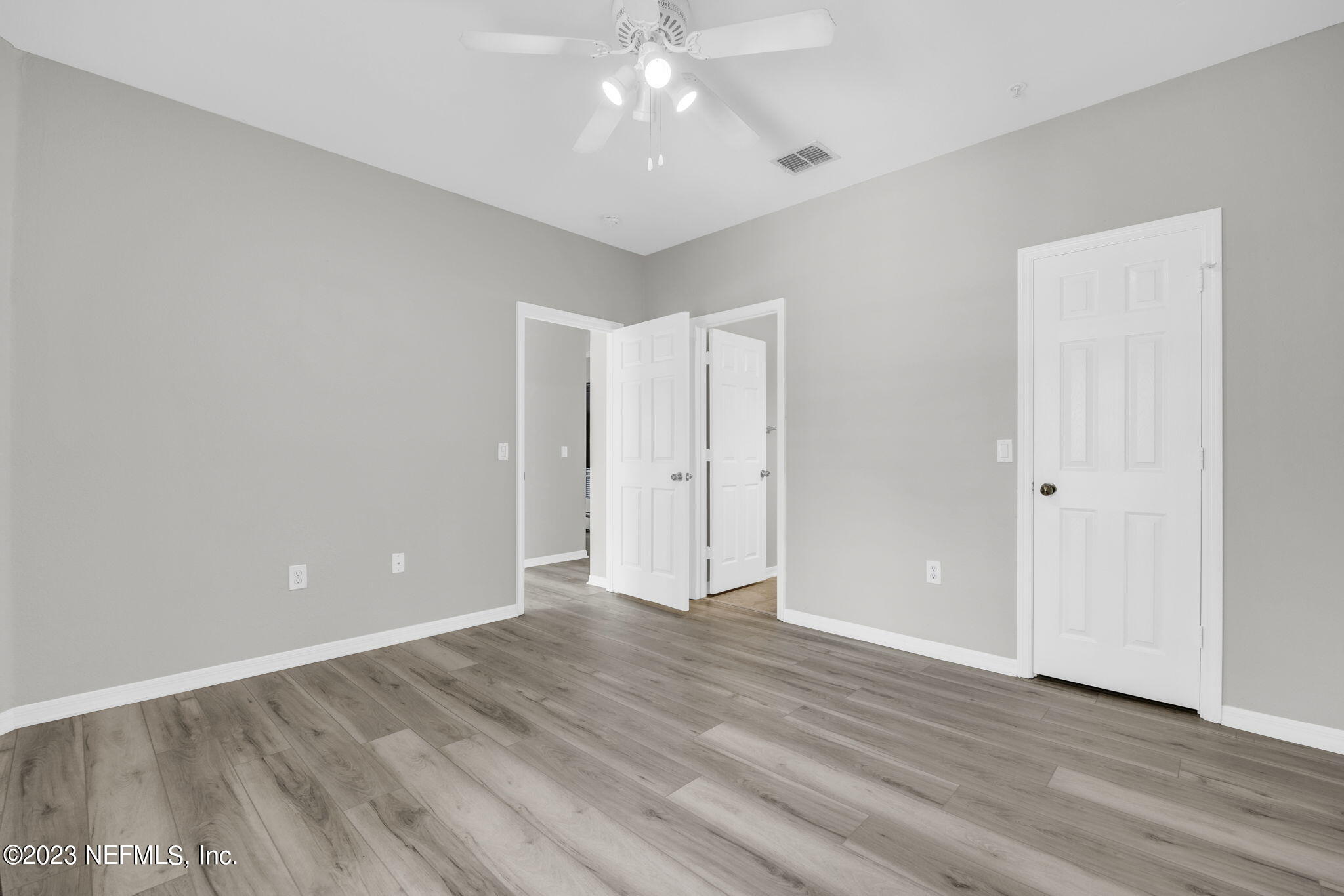 10961 Burnt Mill Road, Unit 427 Jacksonville, FL 32256 - Photo 21 of 50 a view of an empty room with wooden floor