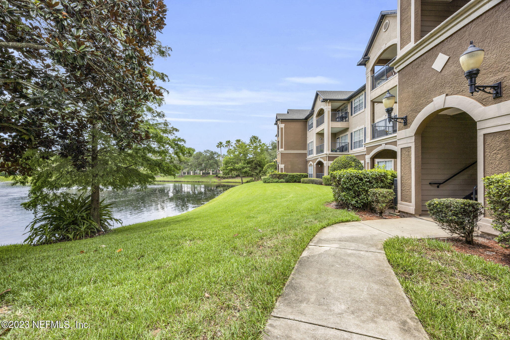 10961 Burnt Mill Road, Unit 427 Jacksonville, FL 32256 - Photo 3 of 50 a view of a garden with a pathway