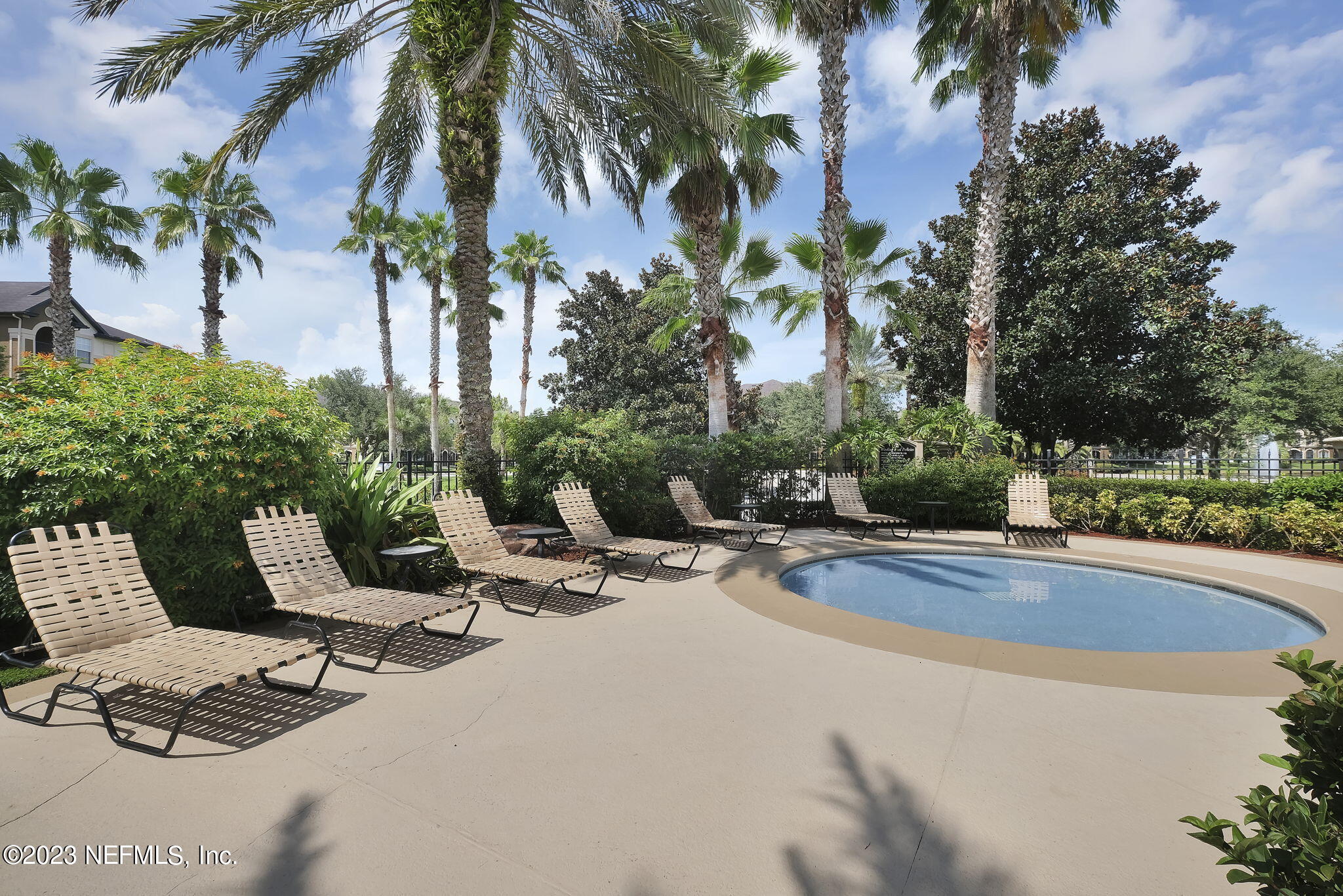 10961 Burnt Mill Road, Unit 427 Jacksonville, FL 32256 - Photo 40 of 50 a view of a swimming pool with lounge chair