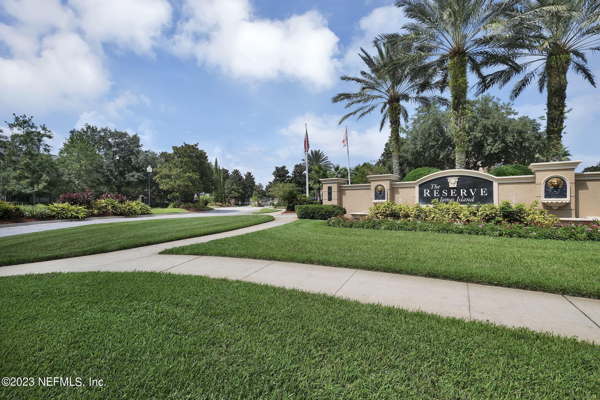10961 Burnt Mill Road, Unit 427 Jacksonville, FL 32256 - Photo 44 of 50 a front view of a house with a garden and trees