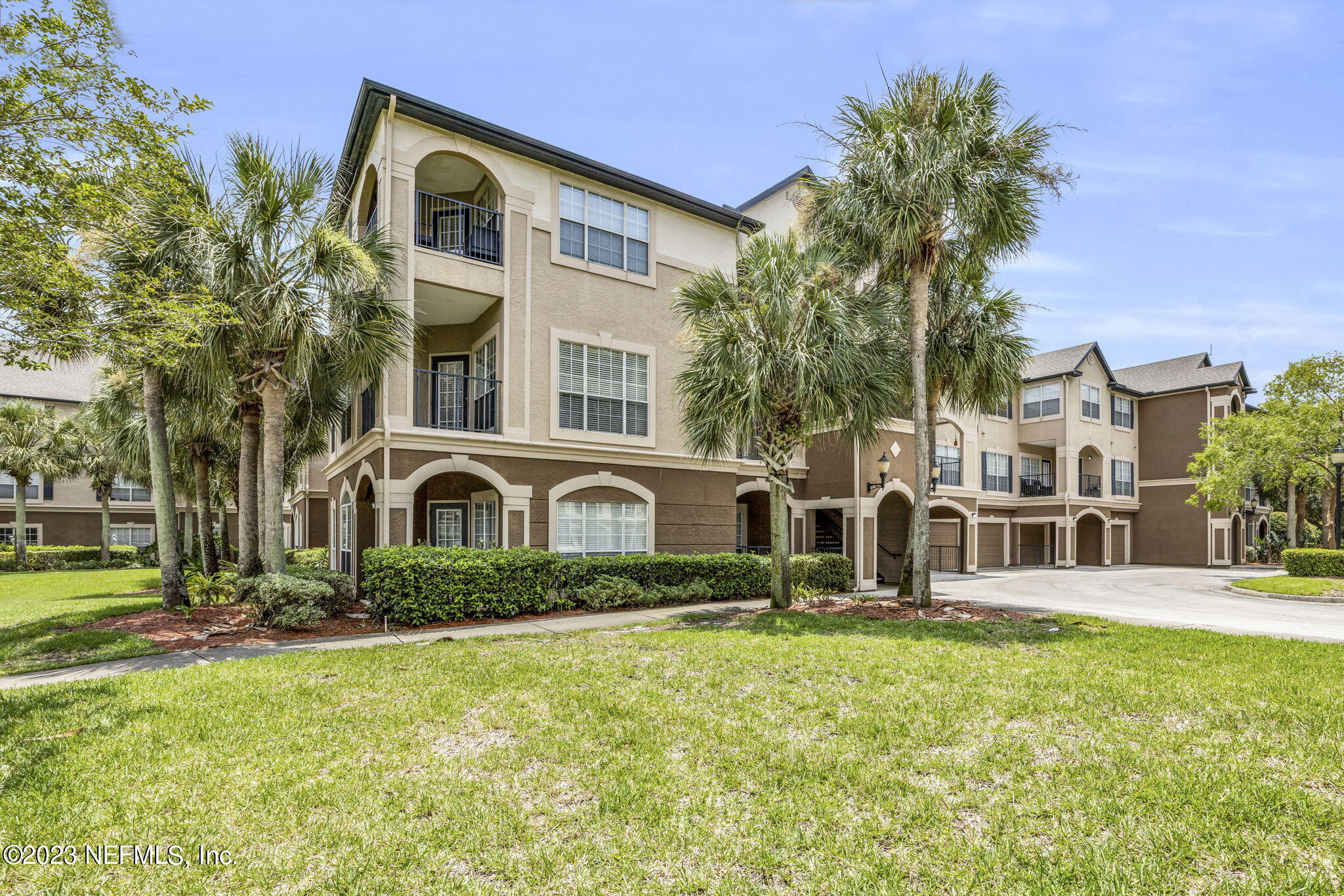 10961 Burnt Mill Road, Unit 427 Jacksonville, FL 32256 - Photo 47 of 50 a front view of a house with a yard
