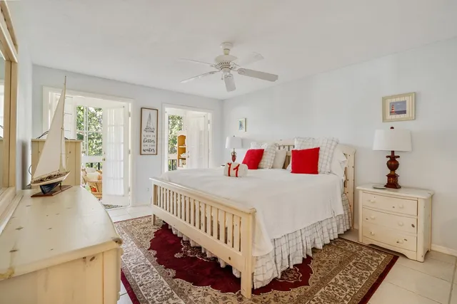 a bedroom with furniture and a window