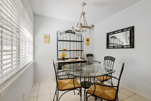 a view of a dining room with furniture and window