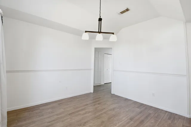 a view of small space with wooden floor