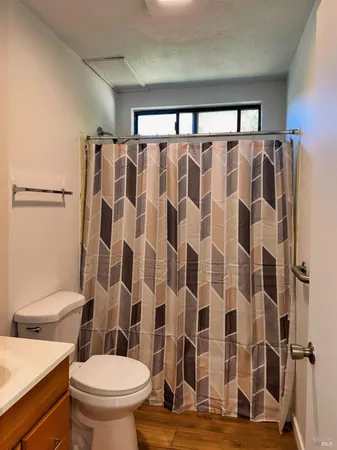 a bathroom with a shower curtain