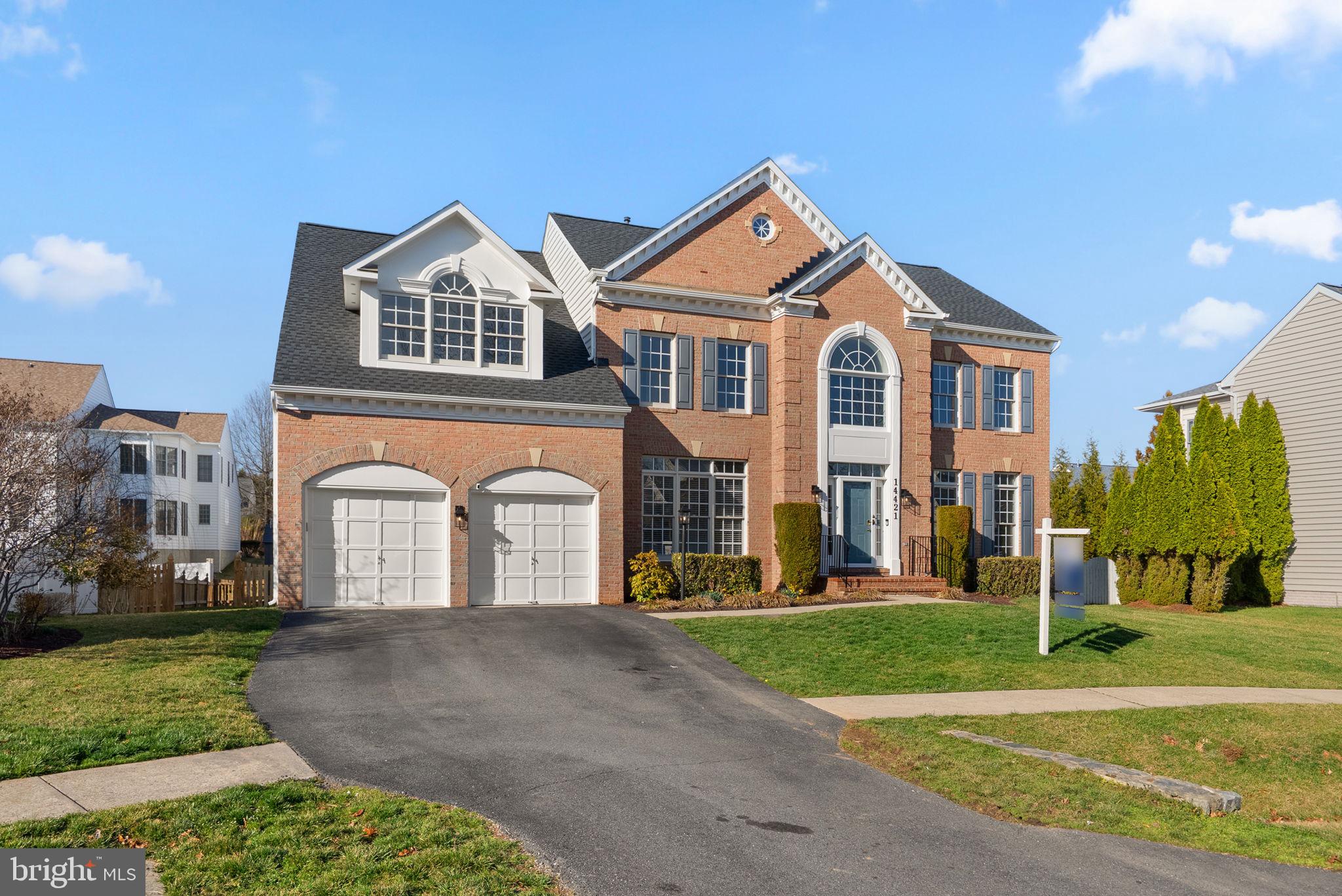 14421 Ashleigh Greene Road Boyds, MD 20841 - Photo 1 of 95 a front view of a house with a yard
